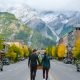 Banff village in Banff national park Canada Canadian Rockies during Autumn fall season. Couple of men and women on vacation in Banff Canada between the mountains